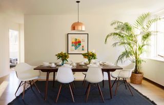 Wood dinning room table with white chair