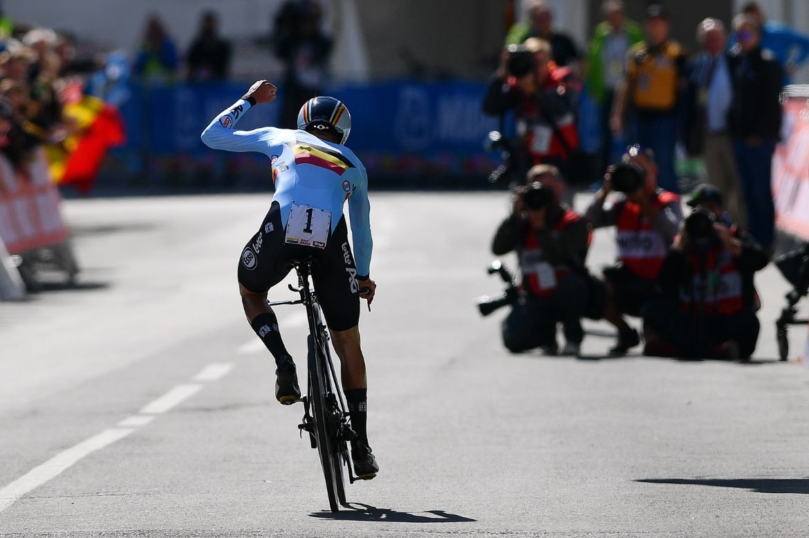 Remco Evenepoel celebrates as he crosses the line