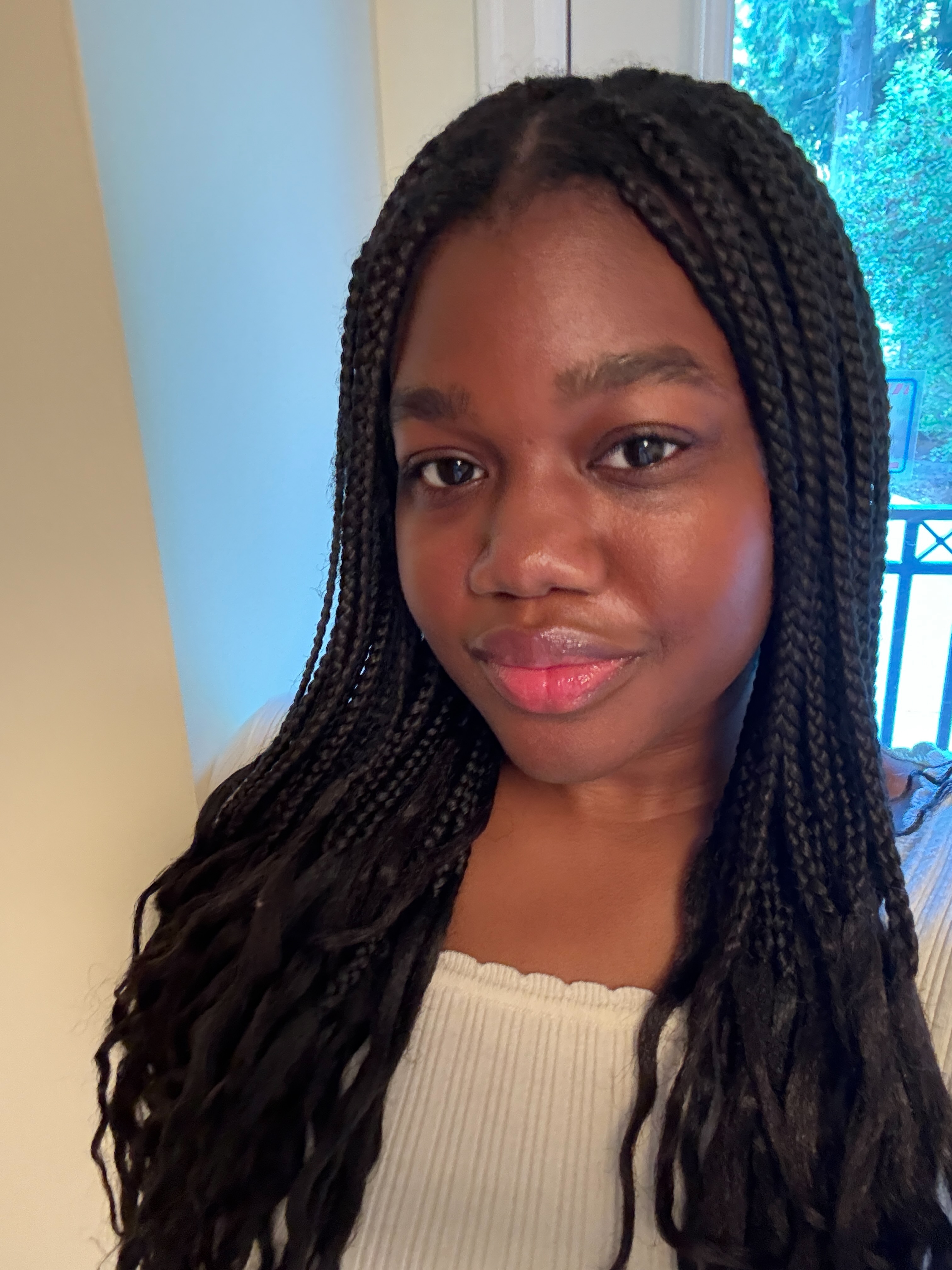 Associate Beauty Editor Maya Thomas after applying the Caudalie Vinoperfect Dark Circle Brightening Cream