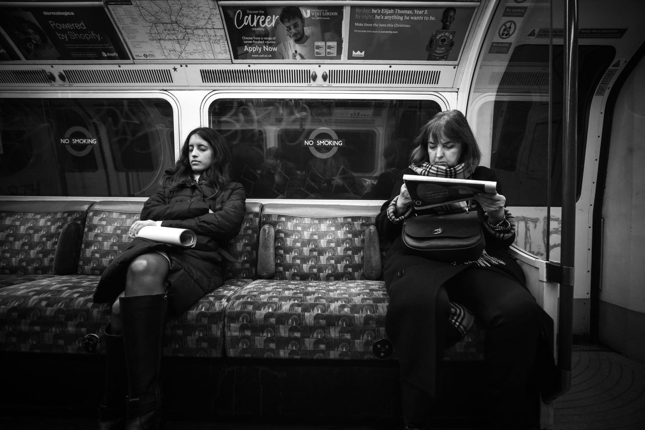 Laowa 15mm f/5 Cookie FF sample image of two people on a London tube carriage taken on a Canon EOS R5