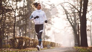 ultimate winter running checklist: woman running with gloves
