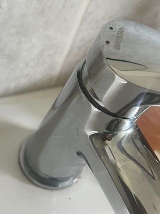 A silver lever tap