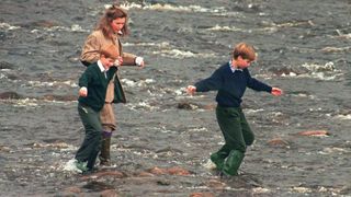 A young Prince William and Harry with their nanny at Balmoral