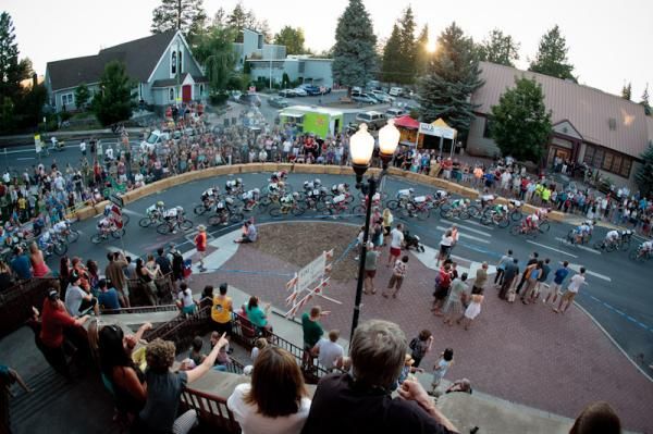Fans watch from anywhere available as riders get through the last turn.