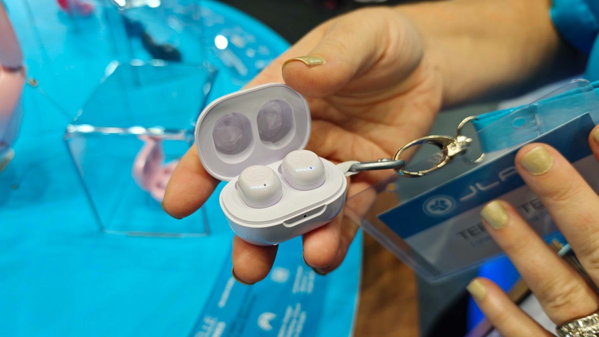 JLab's new earbuds at IFA, on a blue table