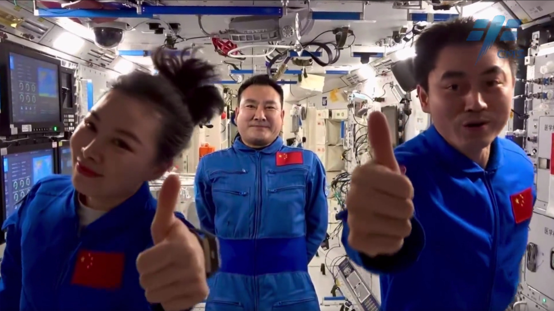 China's Shenzhou 13 astronauts give thumb's up signs as they prepare to return to Earth from the Tiangong space station core module Tianhe in April 2022. They are (from left): Wang Yaping; commander Zhai Zhigang; and Ye Guangfu.