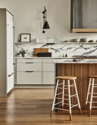 a modern shaker kitchen with a reeded island