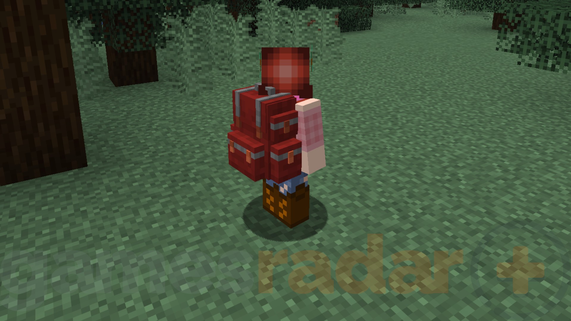 A red-haired Minecraft character wears a red backpack in the Sophisticated Backpacks mod.