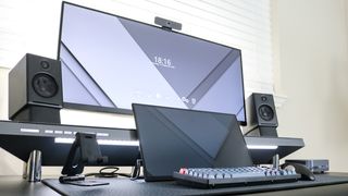 A desk setup built around the Hexcal Studio with a portable monitor in front of it