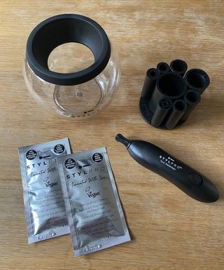 The contents of the STYLPRO Makeup Brush Cleaner and Dryer original set