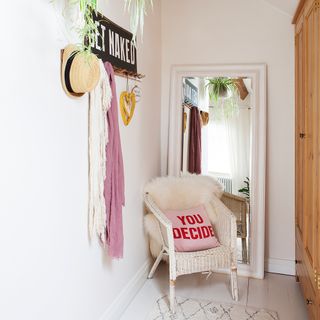 hallway and white wall and wooden cupboard and chair