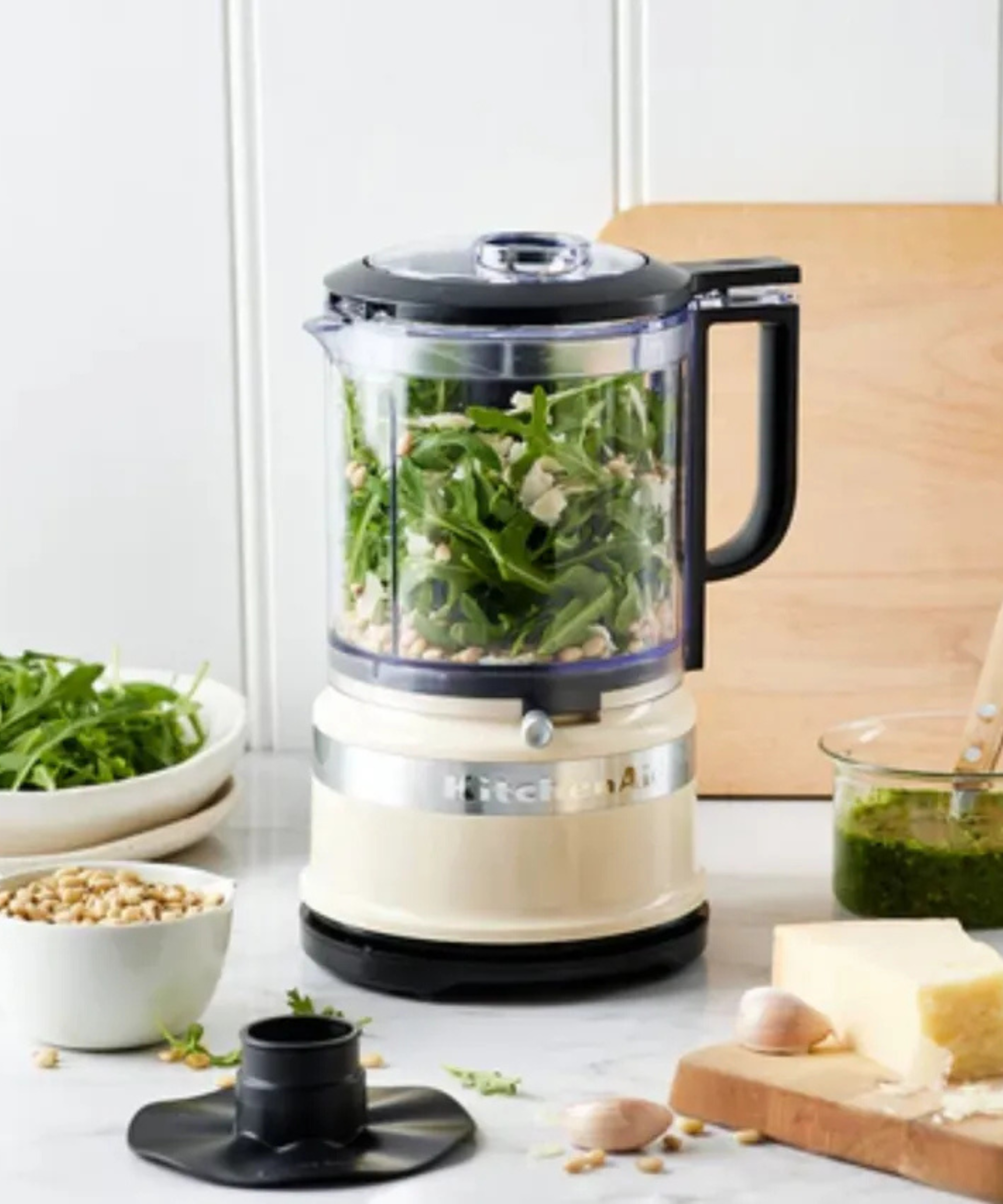 KitchenAid food chopper in cream, blending a fresh rocket pesto