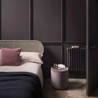 A bedroom painted in dark aubergine 'Pontefract' paint by Paint & Paper Library