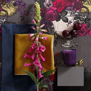 room with floral printed wall and pink flower