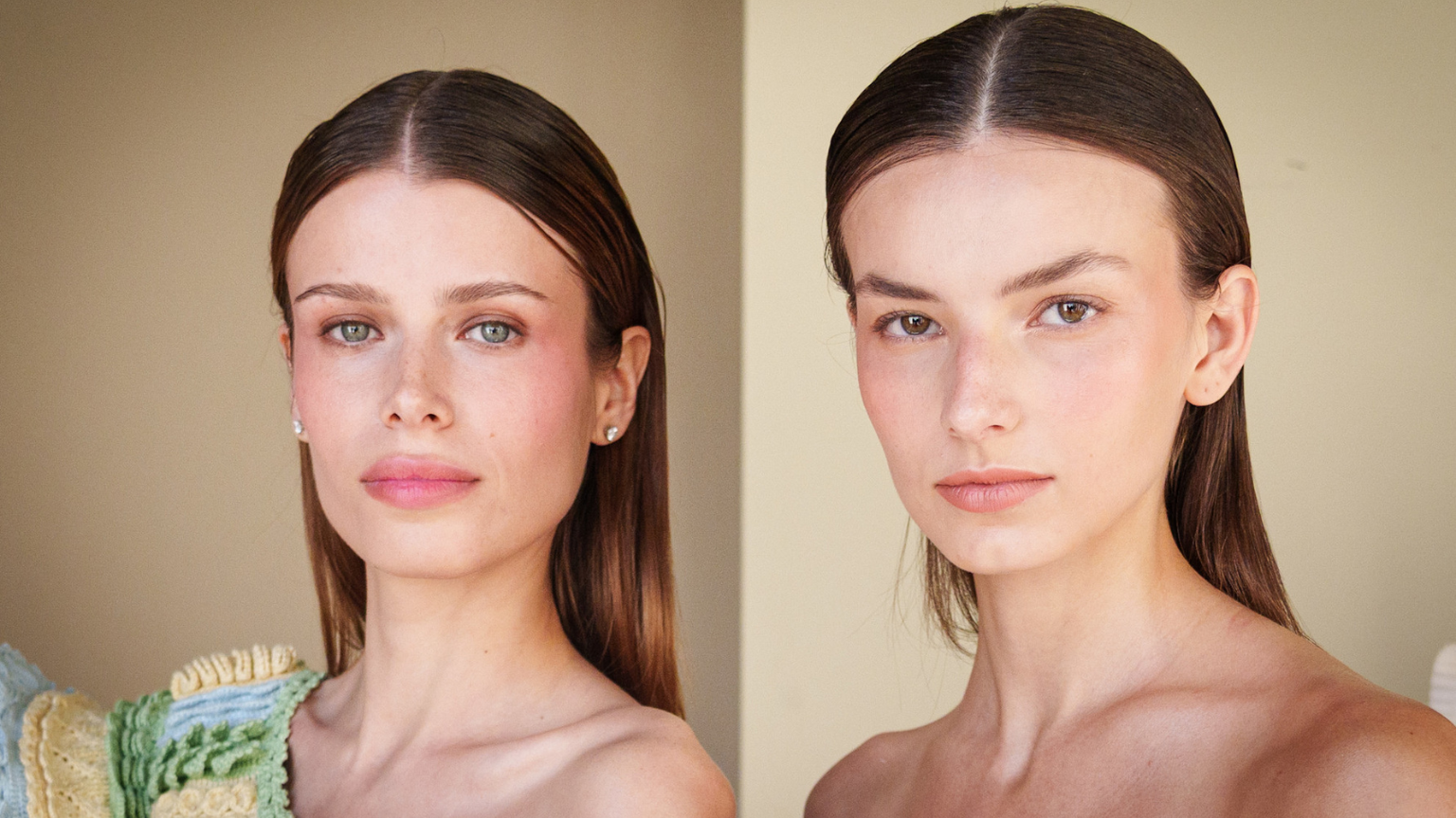 two white women with dark brown hair and flushed cheeks