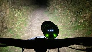 Rear view of Exposure Six Pack Mk12 mounted on handlebars in use at night