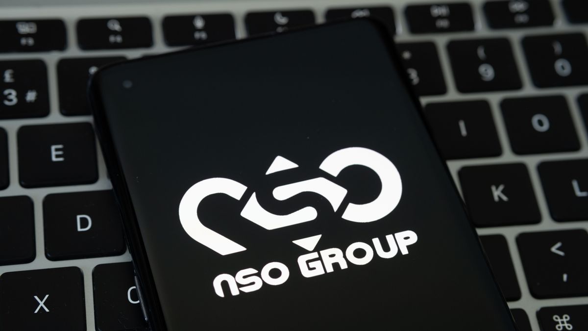 The NSO Group logo on a smartphone that&amp;#039;s been placed on a keyboard