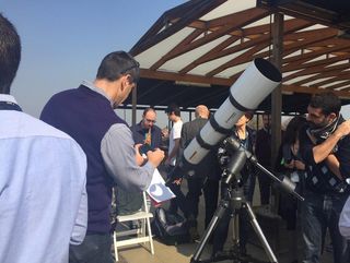 Solar eclipse watchers at the European Space Agency's ESRIN center in Frascati, Italy marvel at partial solar eclipse views on March 20, 2015 during the total solar eclipse of 2015.