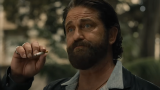 Gerard Butler smoking in Den of Thieves 2