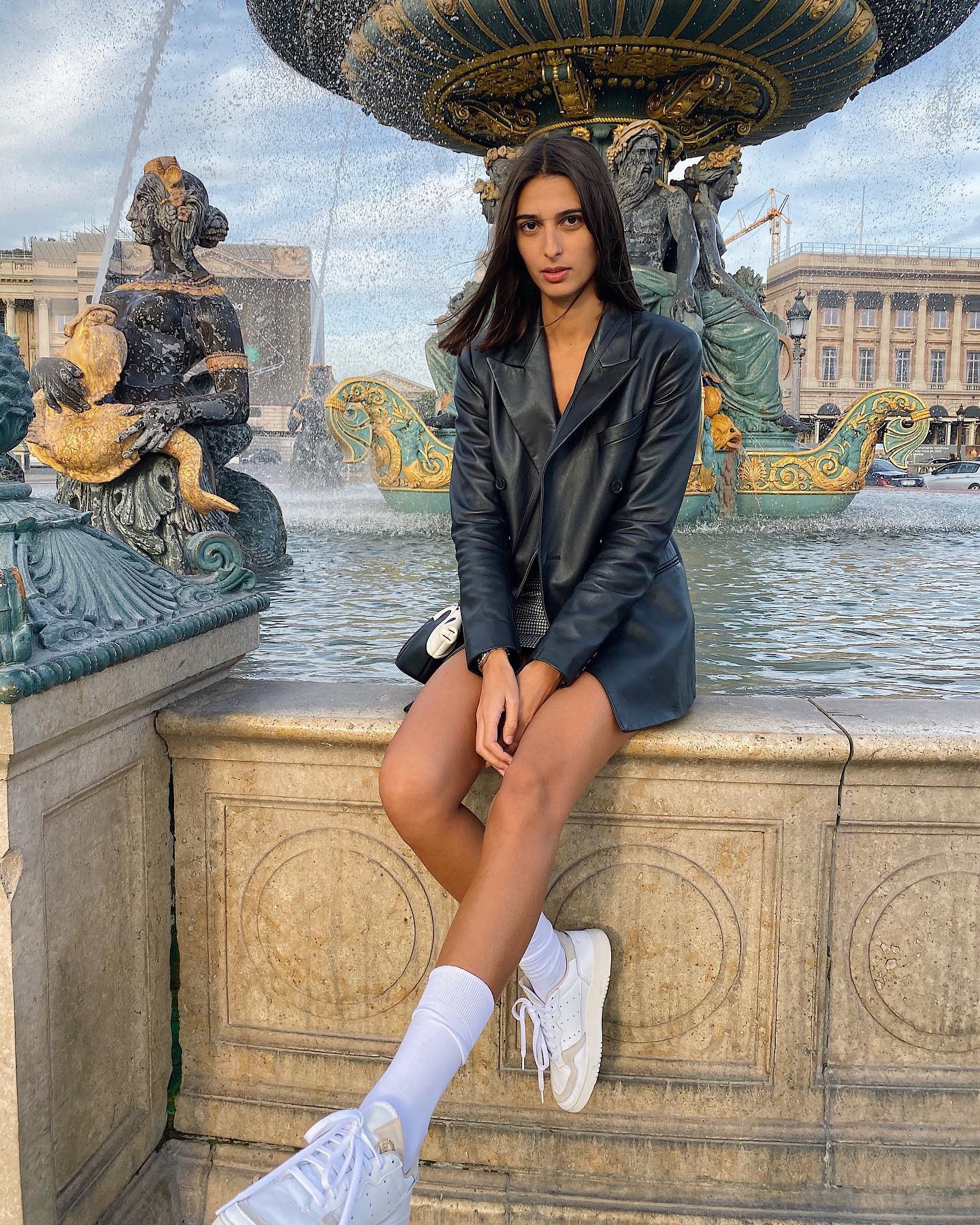 Salome Mory wears a leather blazer in Paris