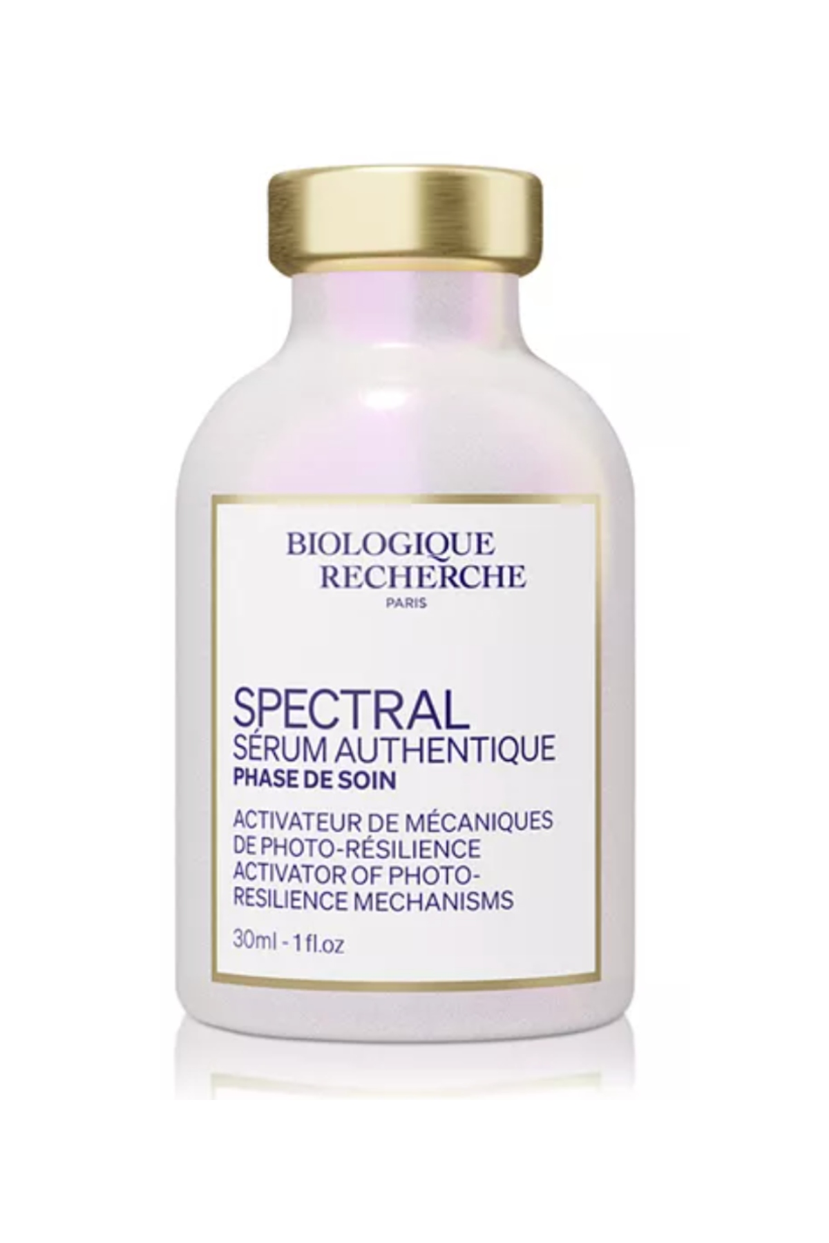 a glass bottle of pink serum