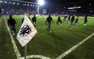 Tottenham players warm up at Tranmere