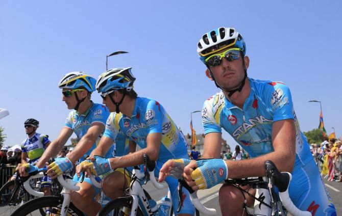 Astana riders await the start of stage 13 in Tours