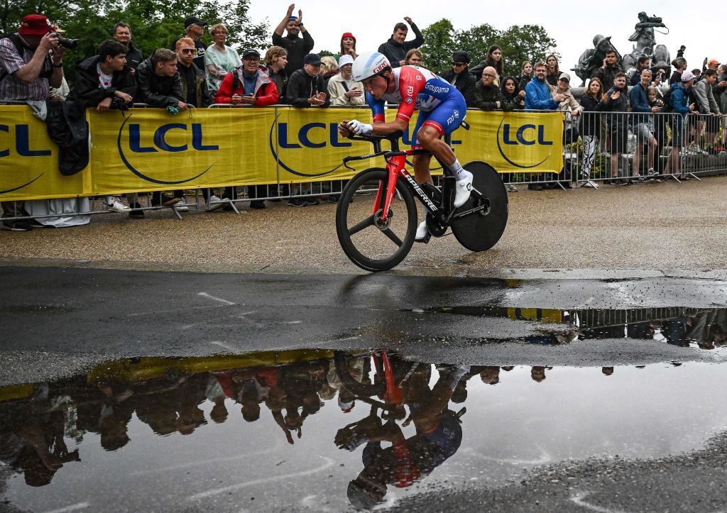 Valentin Madouas rides past a puddle during the Tour de France 2022 stage 1 time trial