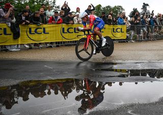 Valentin Madouas rides past a puddle during the Tour de France 2022 stage 1 time trial