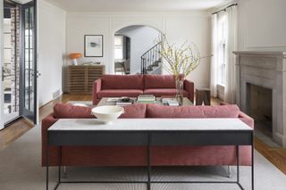 living room with cranberry-colored couches