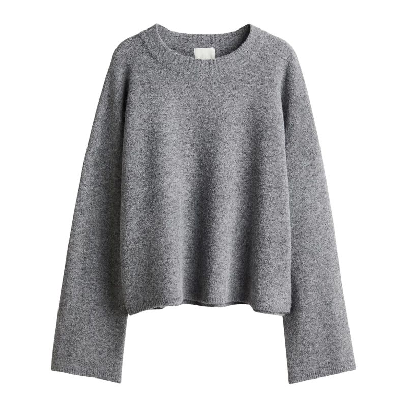 A cutout of a grey crew neck jumper by H&M