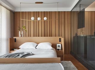 a modern bedroom with a bed in the middle of the room