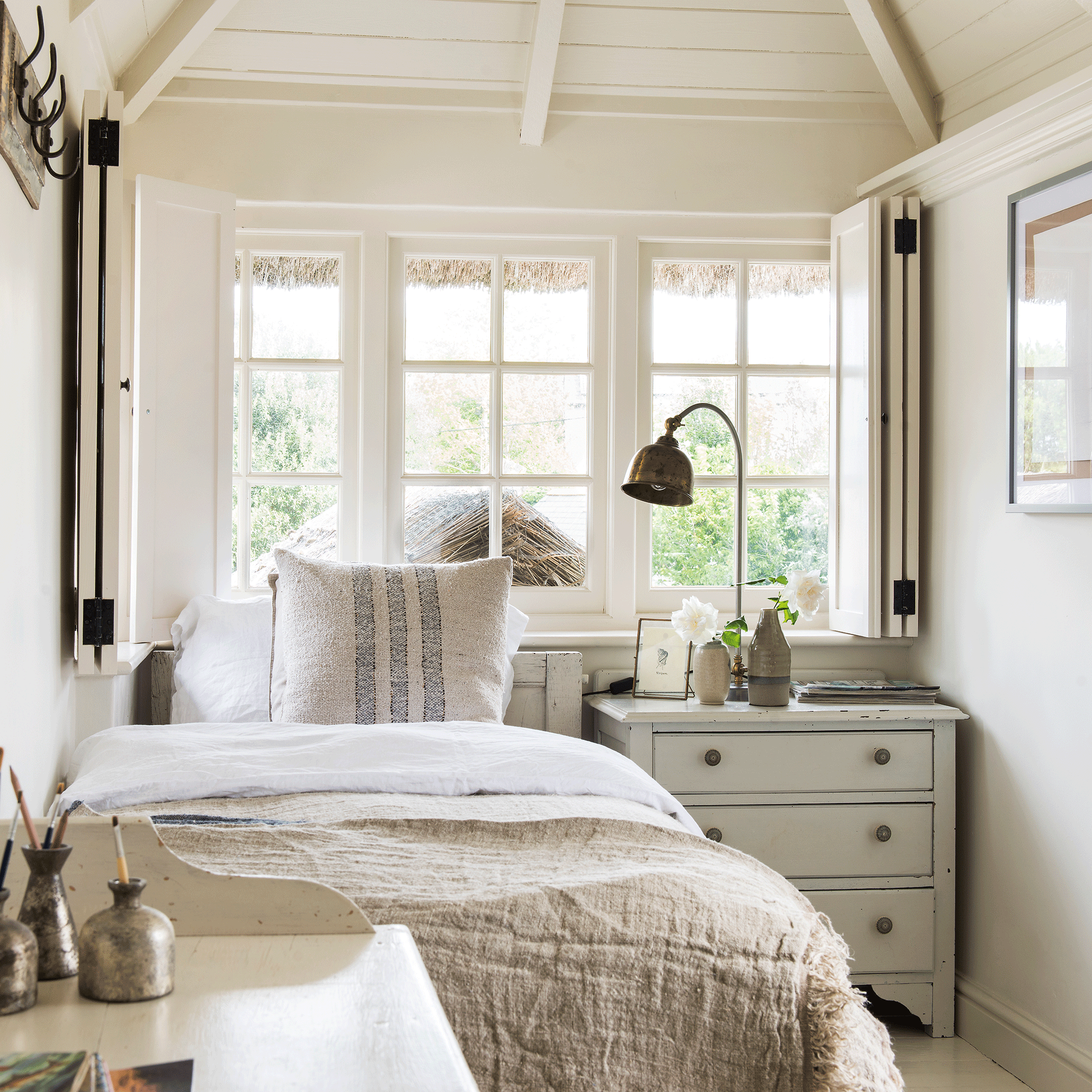 Cream window frames seen from inside a bedroom