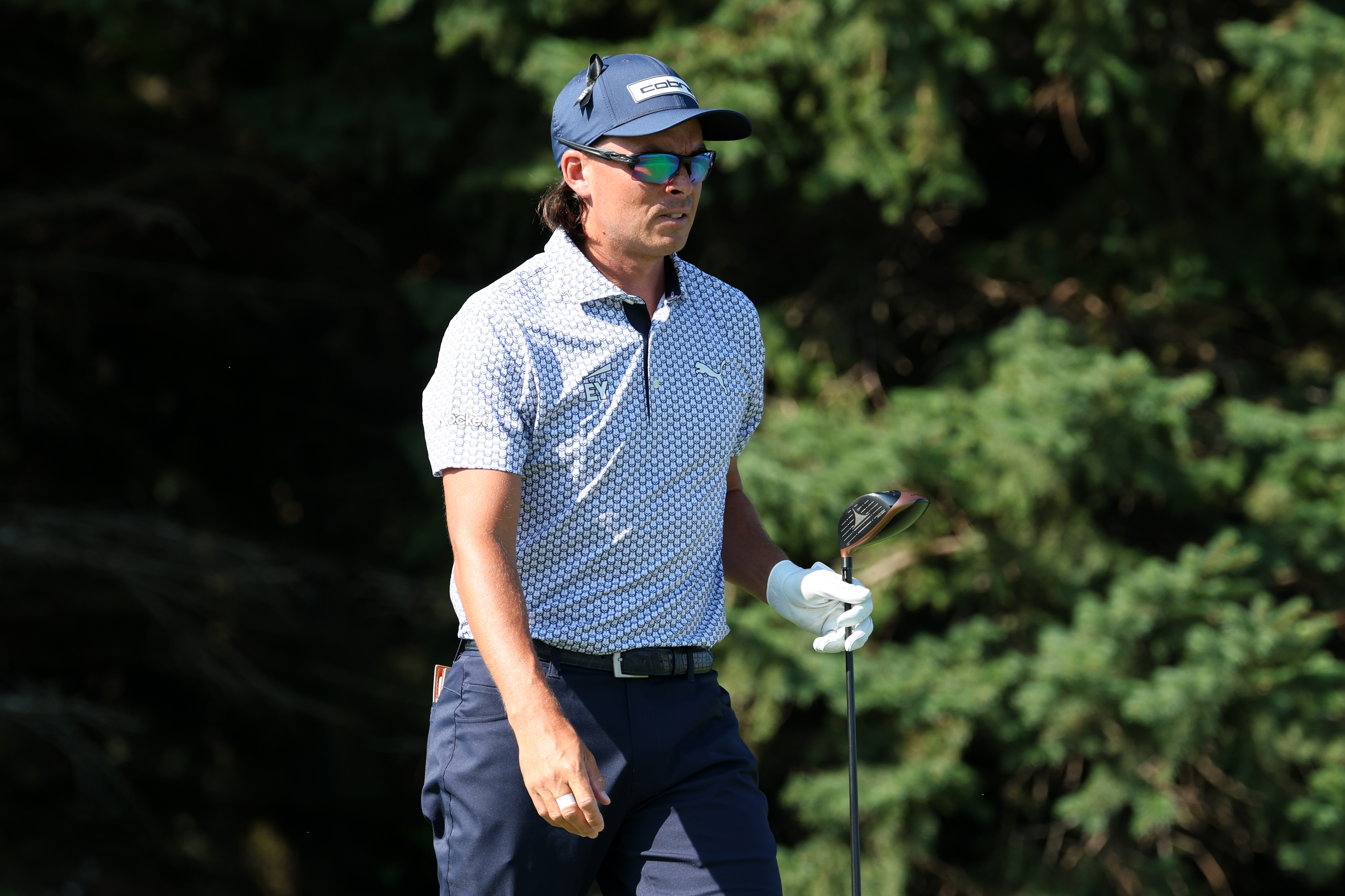 Rickie Fowler walks off the tee