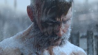 Man covered in frost and blood