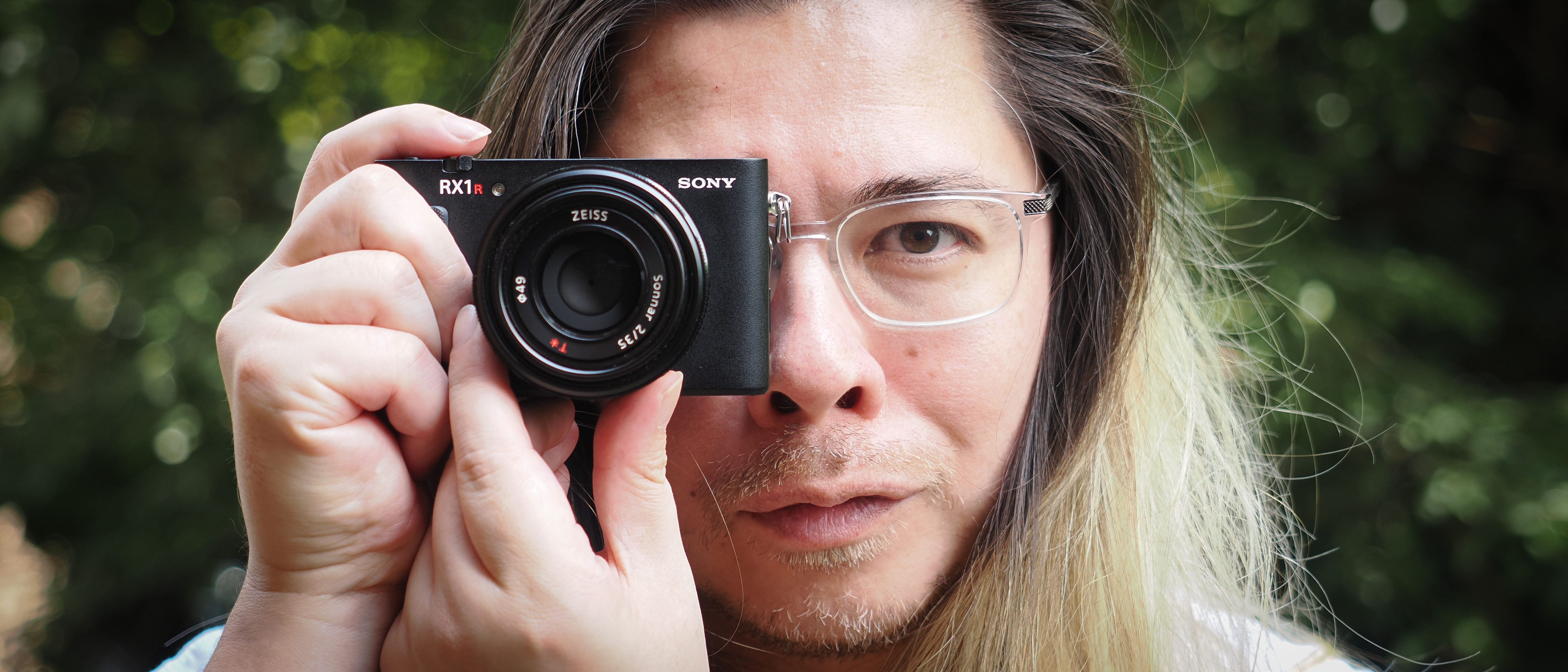 Photographer James Artaius holding the Sony RX1R III camera outdoors