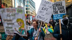 Striking nurses march through London