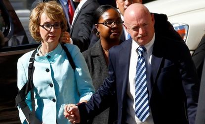 Former Democratic Rep. Gabrielle Giffords, and her husband Mark Kelly are seen after the sentencing of Tucson shooter, Jared Lee Loughner, on Nov. 8, 2012. 