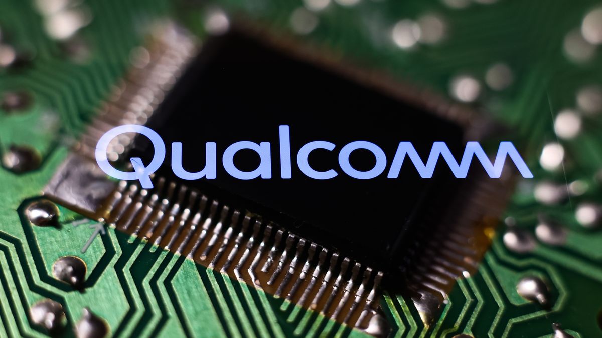 The Qualcomm logo (the word &#039;Qualcomm&#039; in a pale blue stylised font with connected Ms), composited over an extreme close-up shot of a microchip.