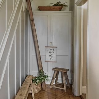 Rustic style hallway with stool and bench