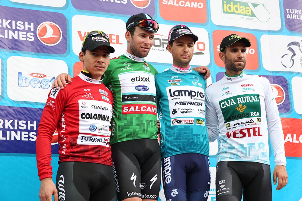 The jersey winners pose on the podium
