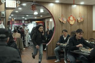 Rose runs through a restaurant in The Night Agent season 2