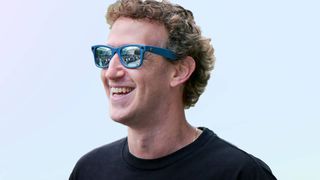 Mark Zuckerberg smiling as he wears the Ray-Ban Meta smart glasses.