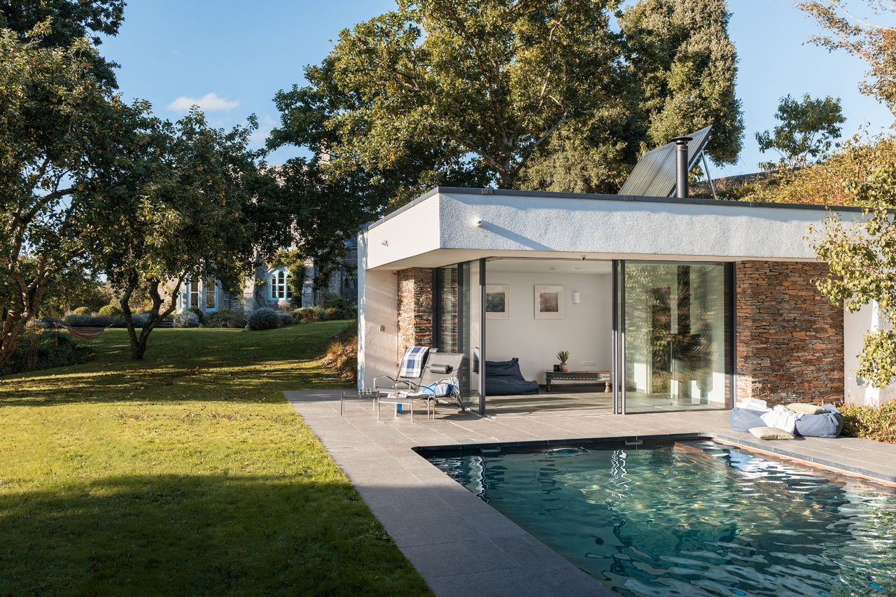 Pool house with sliding doors onto patio