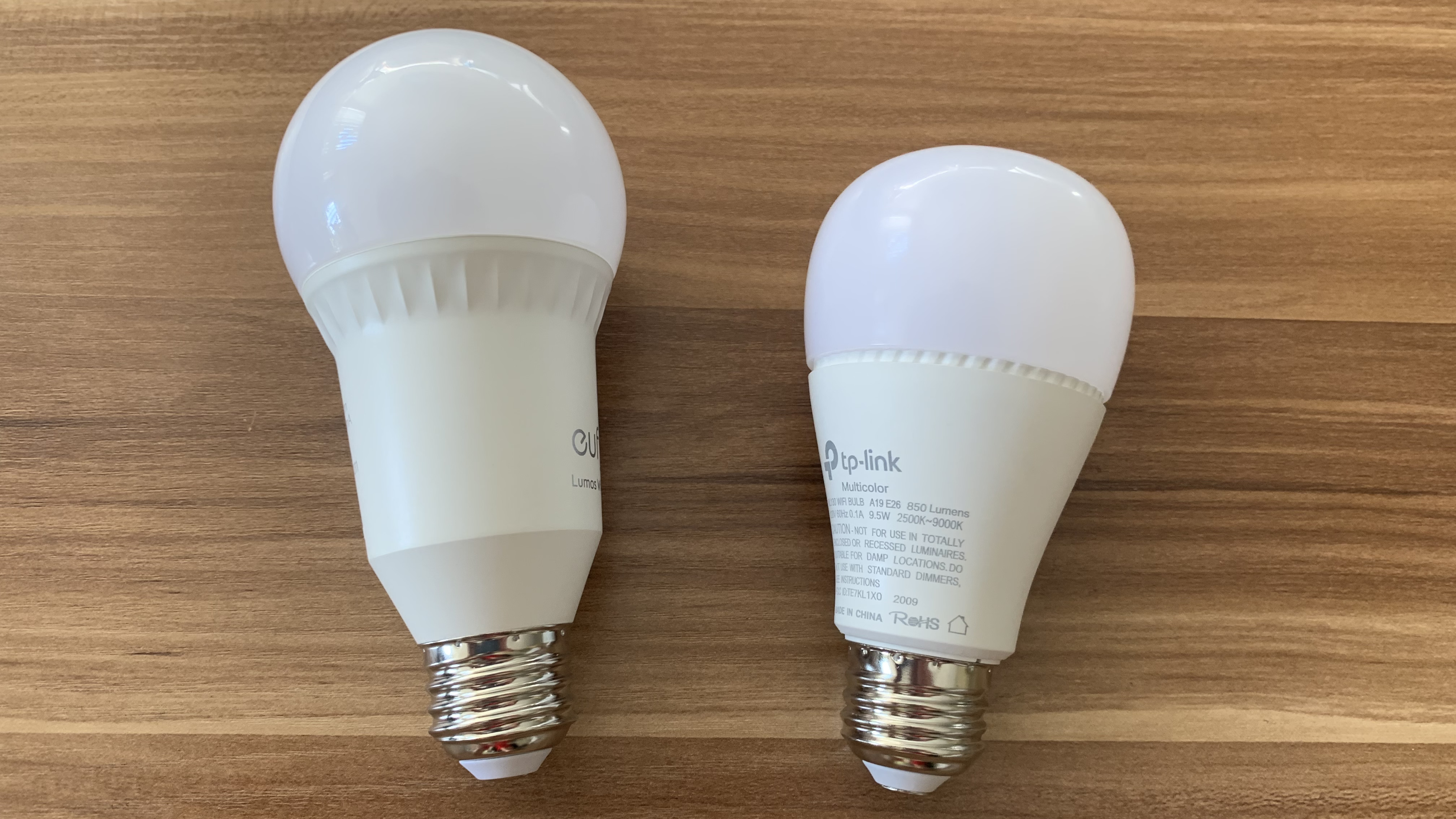 The Eufy Lumos bulb (left) and Kasa Smart bulb (right)