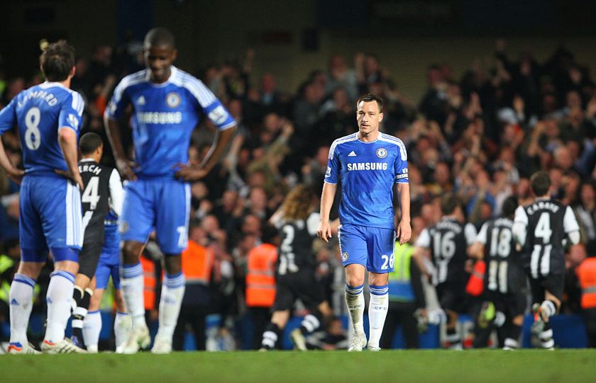 A dejected looking John Terry of Chelsea after Papiss Demba Cisse of Newcastle United scores a goal to make it 0-2 (Photo by AMA/Corbis via Getty Images)