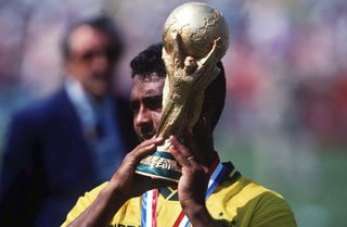 Romario of Brazil holds the World Cup trophy in 1994 in Pasadena, California