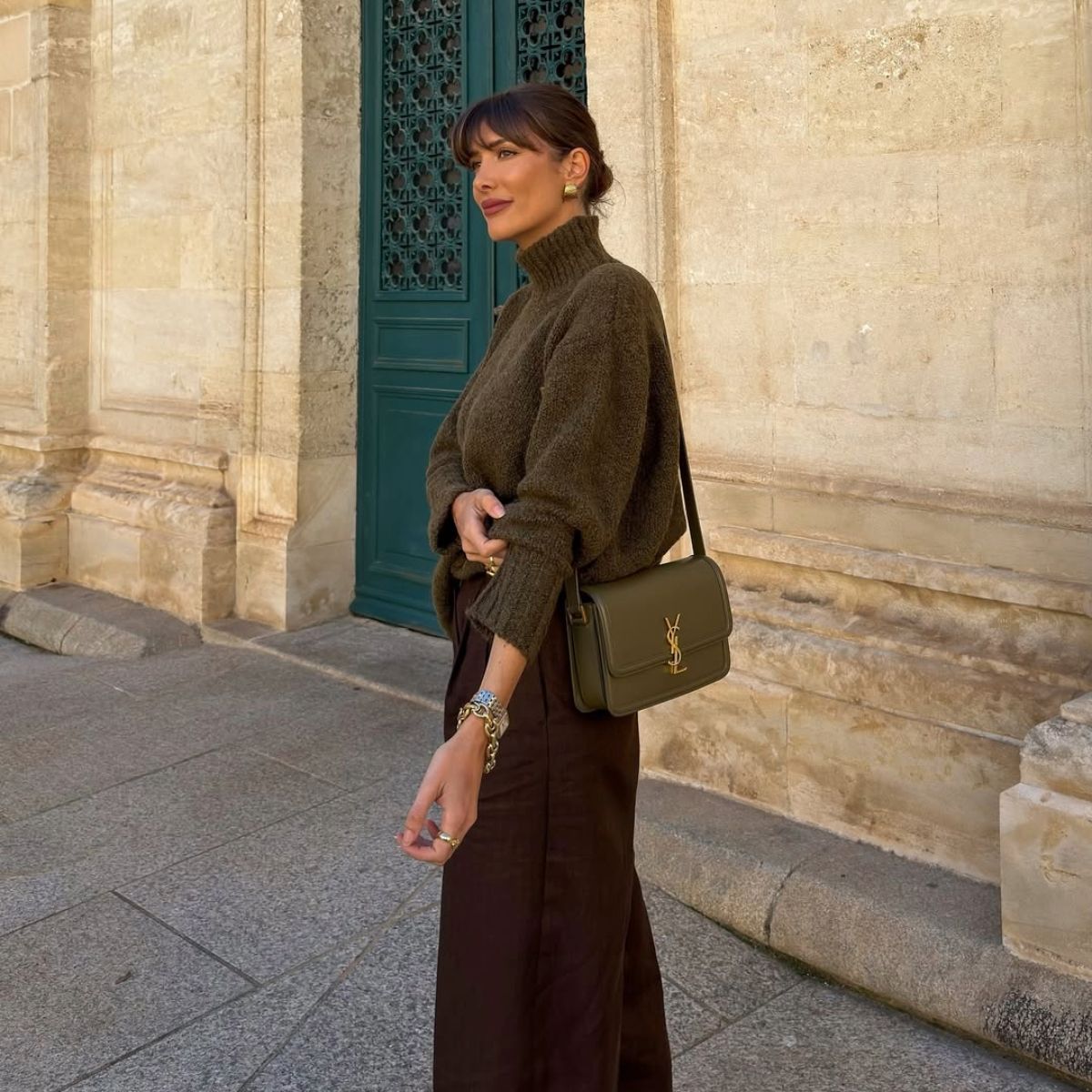 Julie Sergent Ferreri in an olive green sweater and brown skirt. 