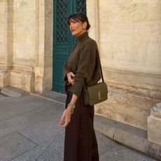 Julie Sergent Ferreri in an olive green sweater and brown skirt. 