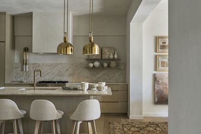 A kitchen with brass accents